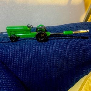 Green Tractor that’s refillable also a bottle opener